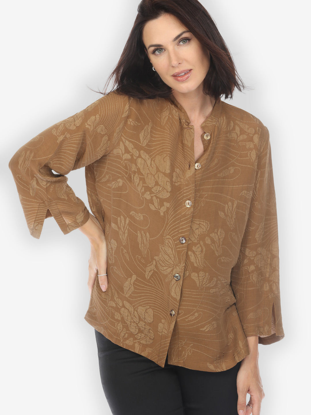 A woman wearing a solid bronze colored silk blouse with 3/4 sleeves and a mandarin collar, in a textured fabric.